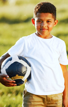 kid holding soccer ball